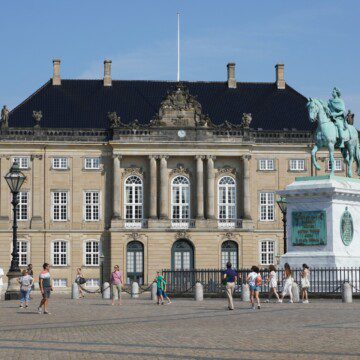 The royal residence, Amalienborg Palace, a cherished sight for tourists renting holiday apartments