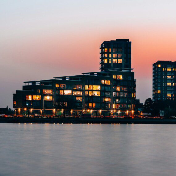 Stunning sunset view of the skyline and modern buildings from Amager Beach Park, with many holiday apartments nearby