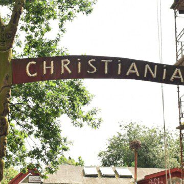 Main entrance to Christiania, Copenhagen, showing the iconic gate of the Freetown community