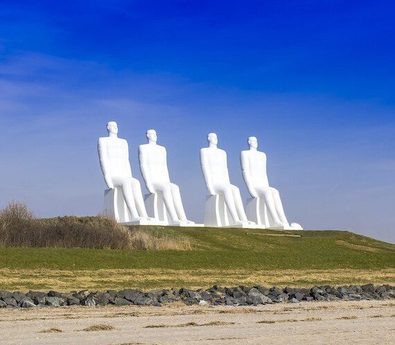 The iconic 'Man Meets the Sea' sculptures in Esbjerg, a popular attraction for guests staying in holiday apartments in Denmark