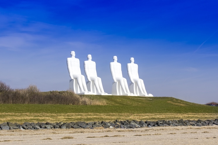 The iconic 'Man Meets the Sea' sculptures in Esbjerg, a popular attraction for guests staying in holiday apartments in Denmark