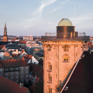 Arial view of the Round Tower in Copenhagen city centre, with nearby holiday apartments